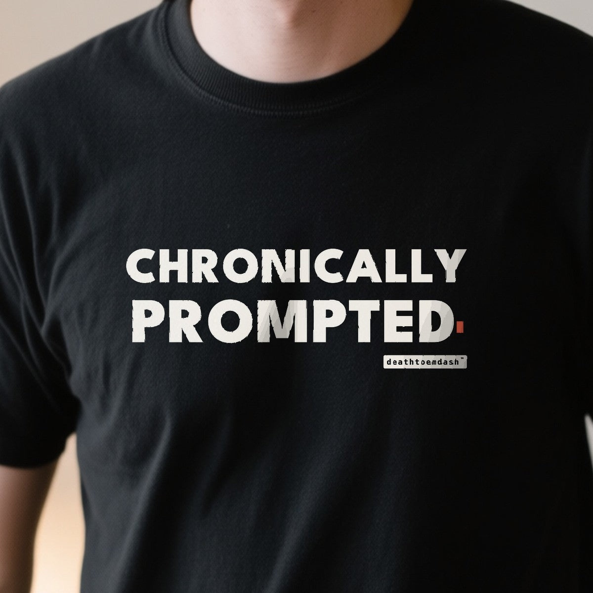 Chronically Prompted design shown close up on a black unisex t-shirt