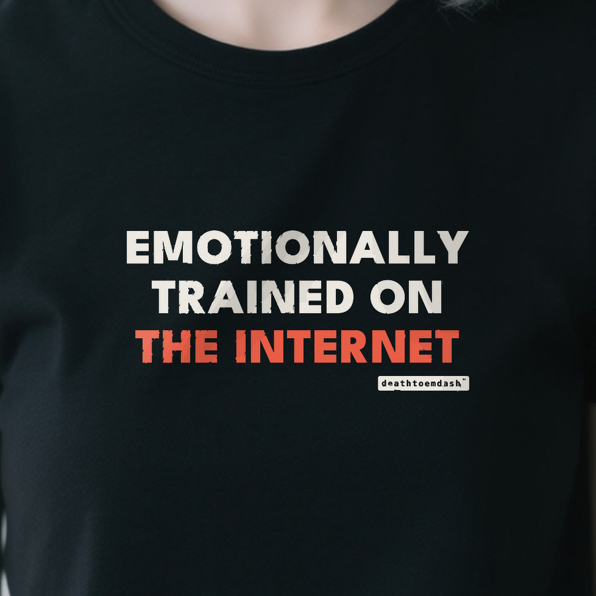 Emotionally Trained On The Internet design shown close up on a black unisex t-shirt