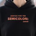 Justice For The Semicolon design shown close up on a black unisex hoodie
