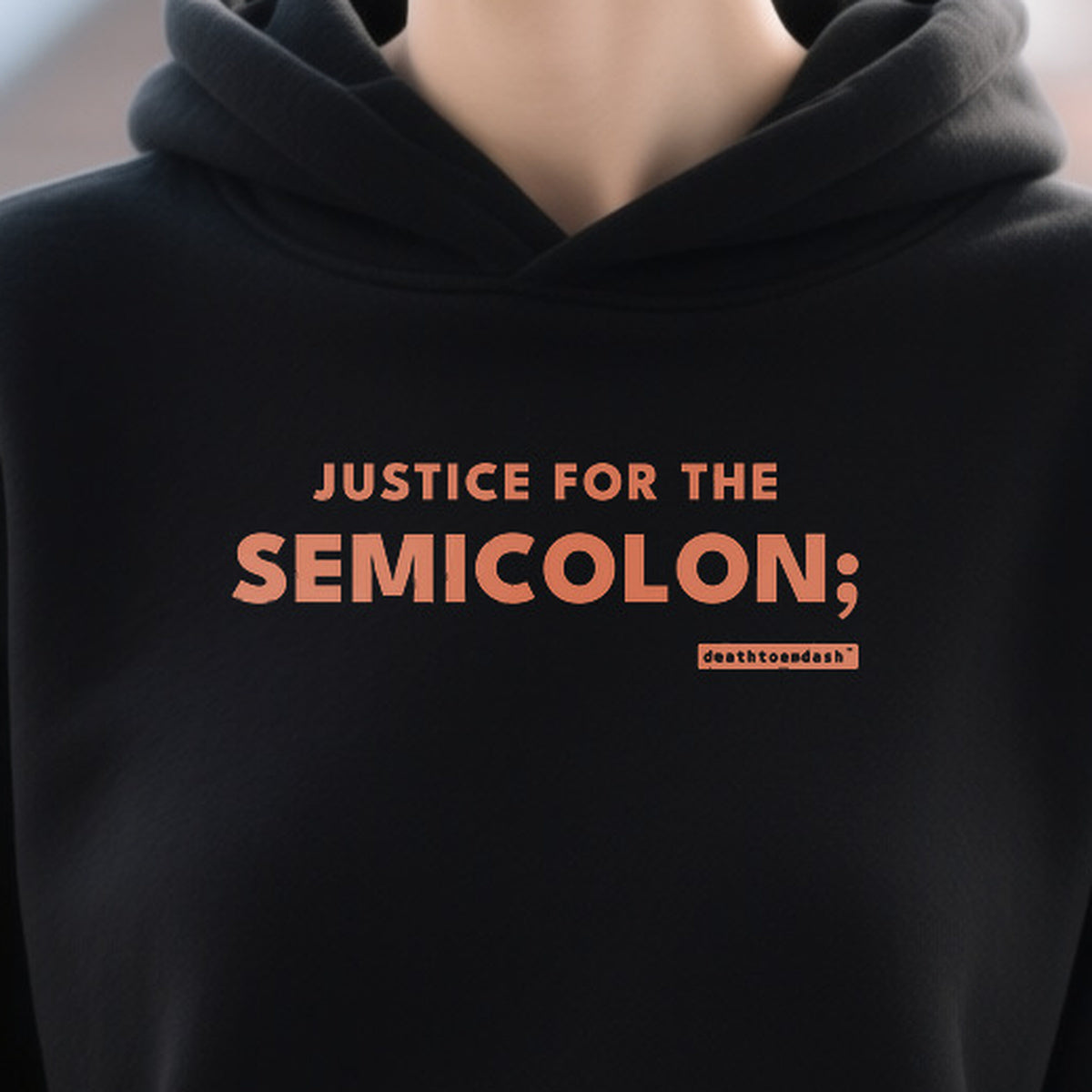 Justice For The Semicolon design shown close up on a black unisex hoodie