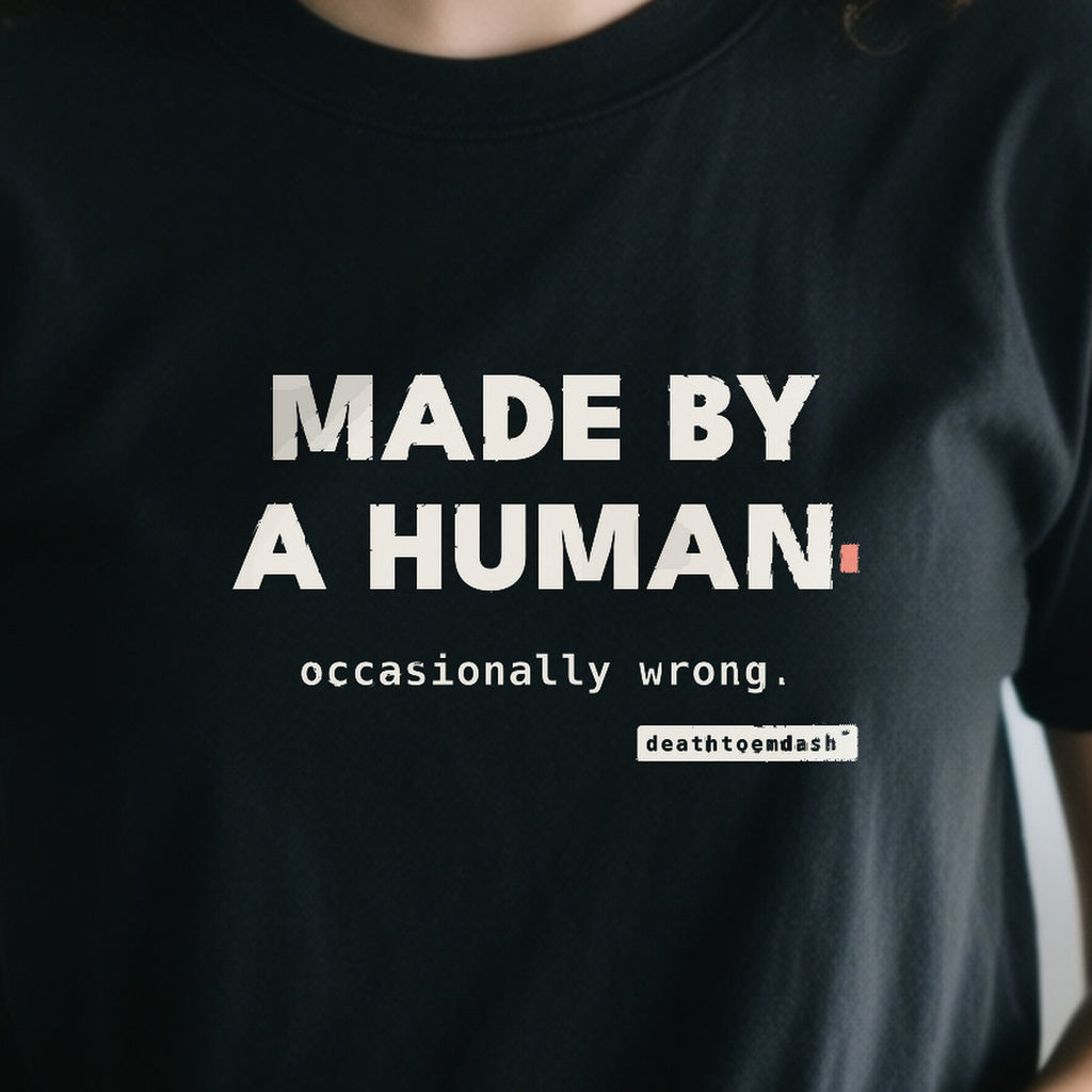 Made By A Human Occasionally Wrong design shown close up on a black unisex t-shirt
