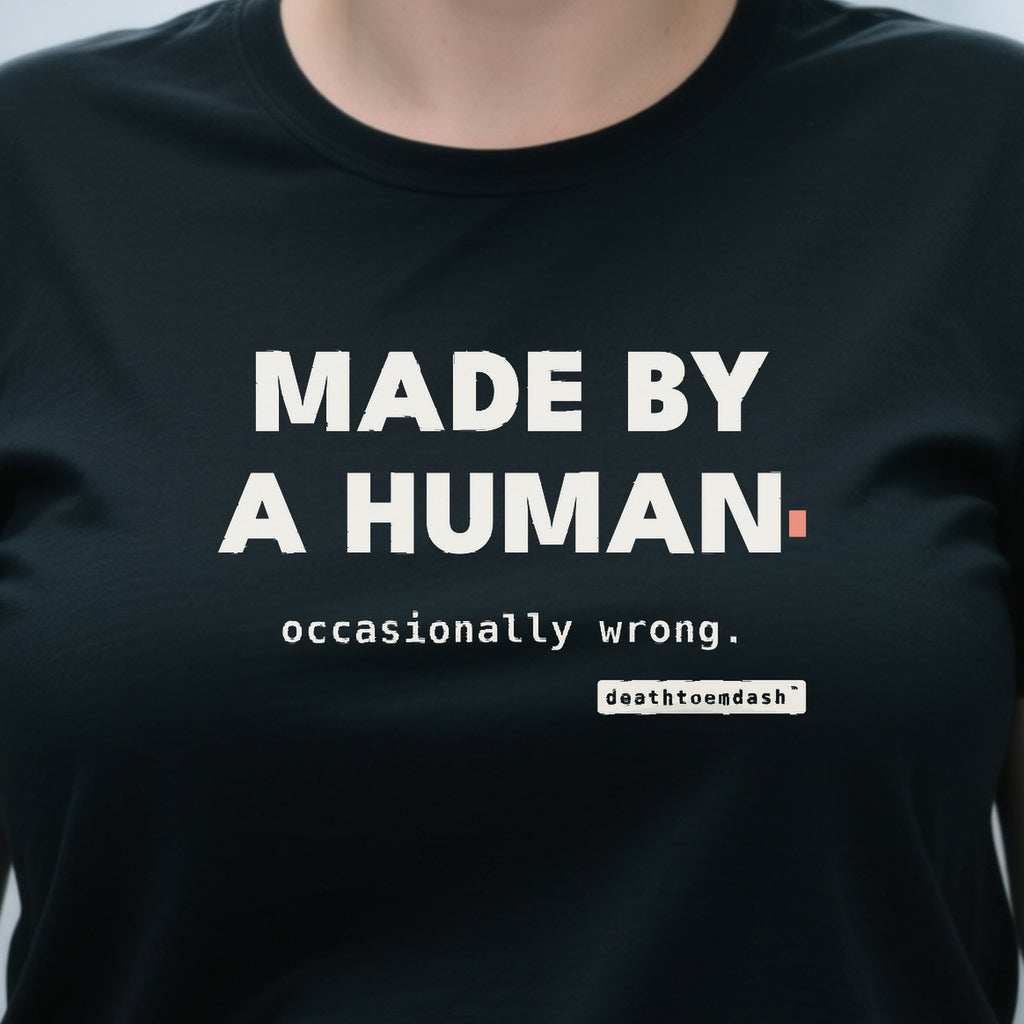 Made By A Human Occasionally Wrong design shown close up on a black unisex t-shirt
