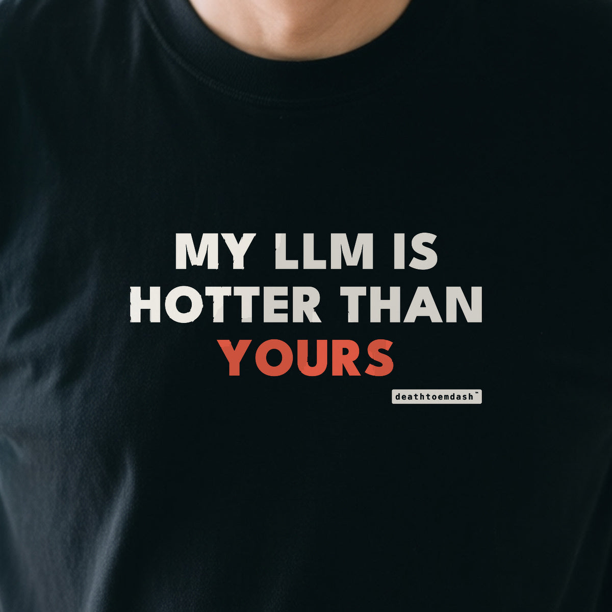 My Llm Is Hotter Than Yours design shown close up on a black unisex t-shirt