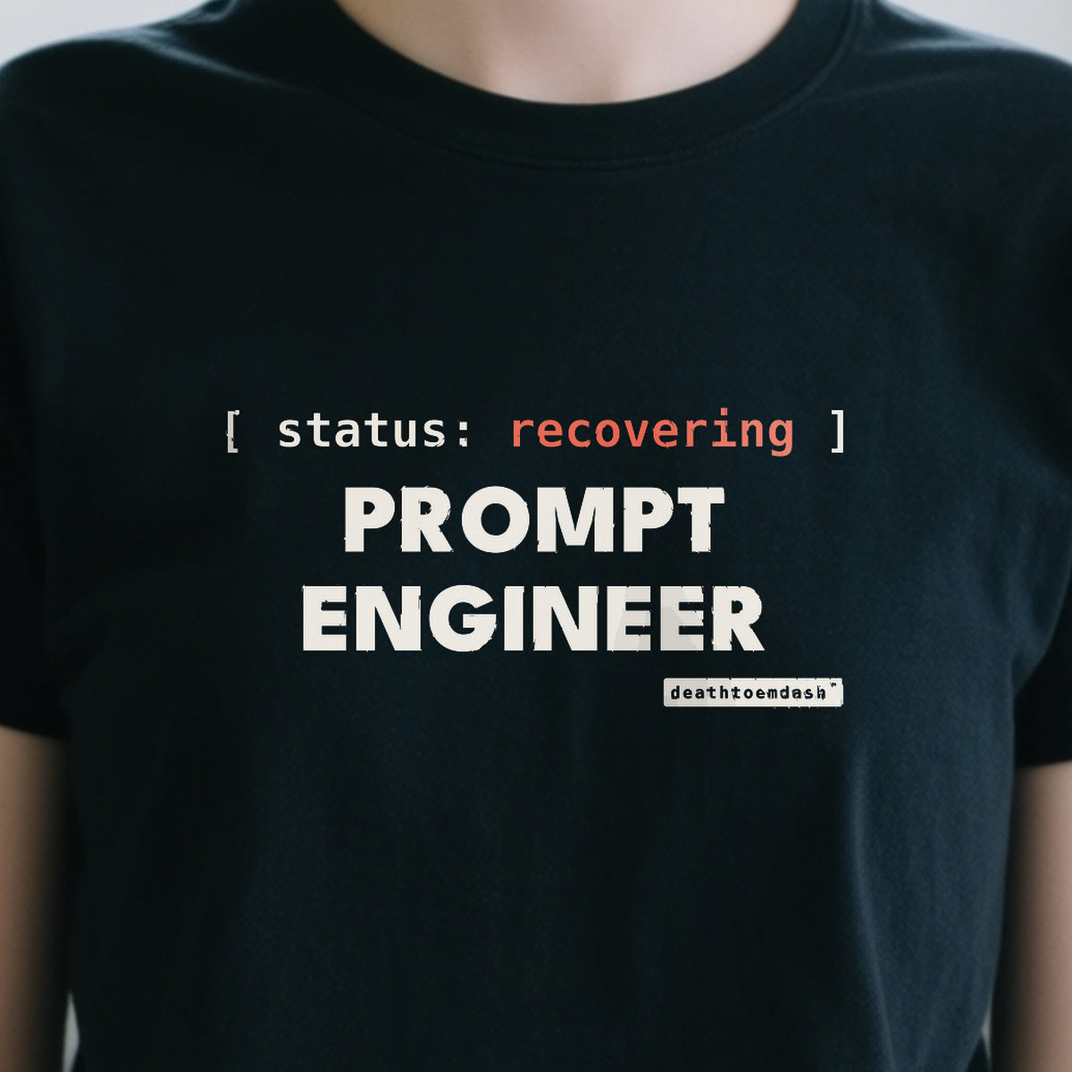 Recovering Prompt Engineer design shown close up on a black unisex t-shirt