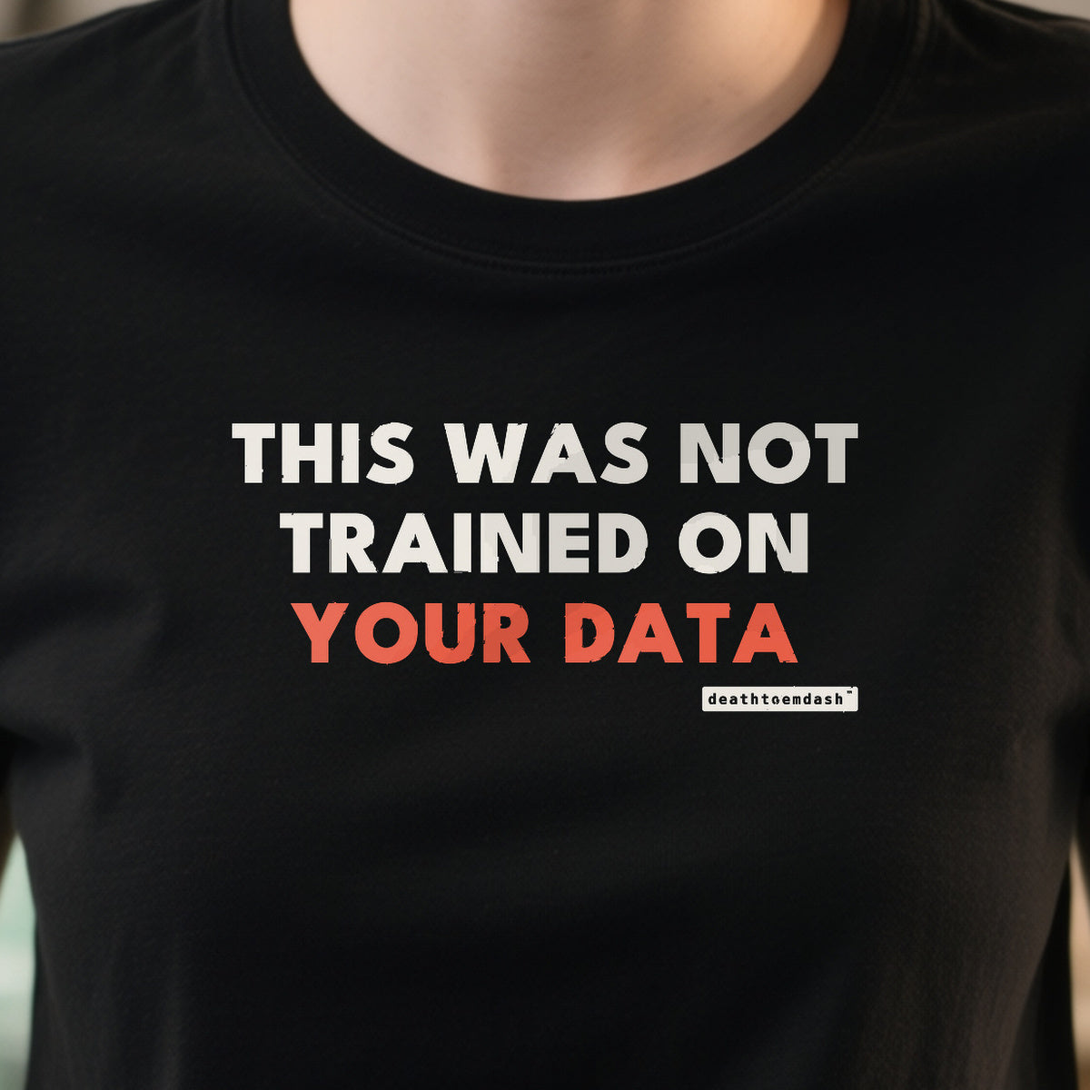 This Was Not Trained On Your Data design shown close up on a black unisex t-shirt
