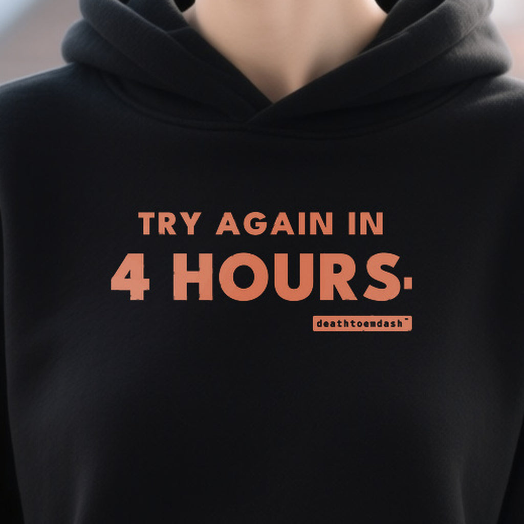 Try Again In 4 Hours design shown close up on a black unisex t-shirt