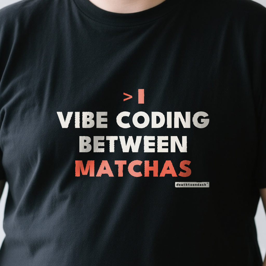 Vibe Coding Between Matchas design shown close up on a black unisex t-shirt