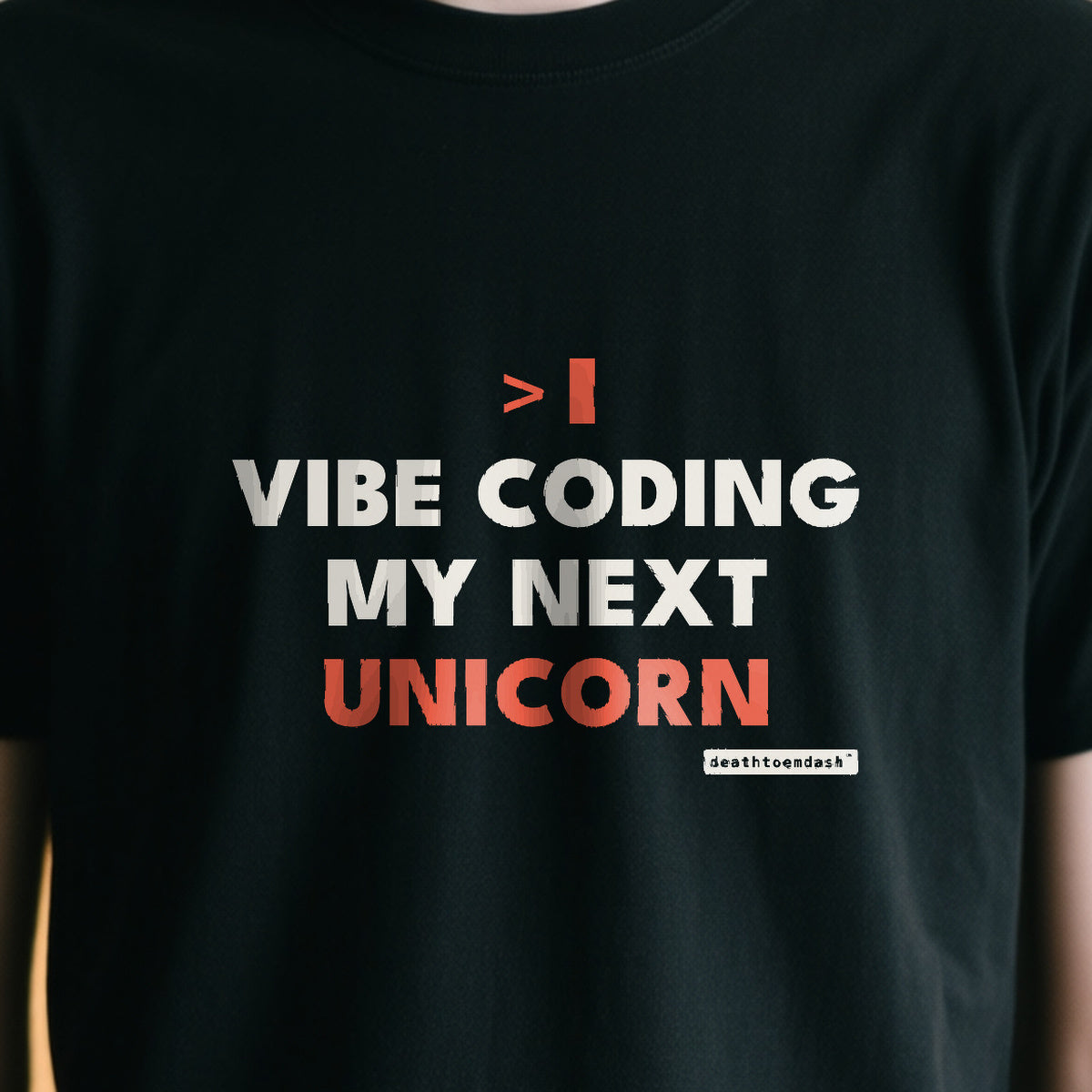 Vibe Coding My Next Unicorn design shown close up on a black unisex t-shirt