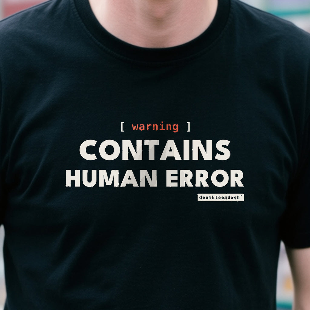 Warning Contains Human Error design shown close up on a black unisex t-shirt