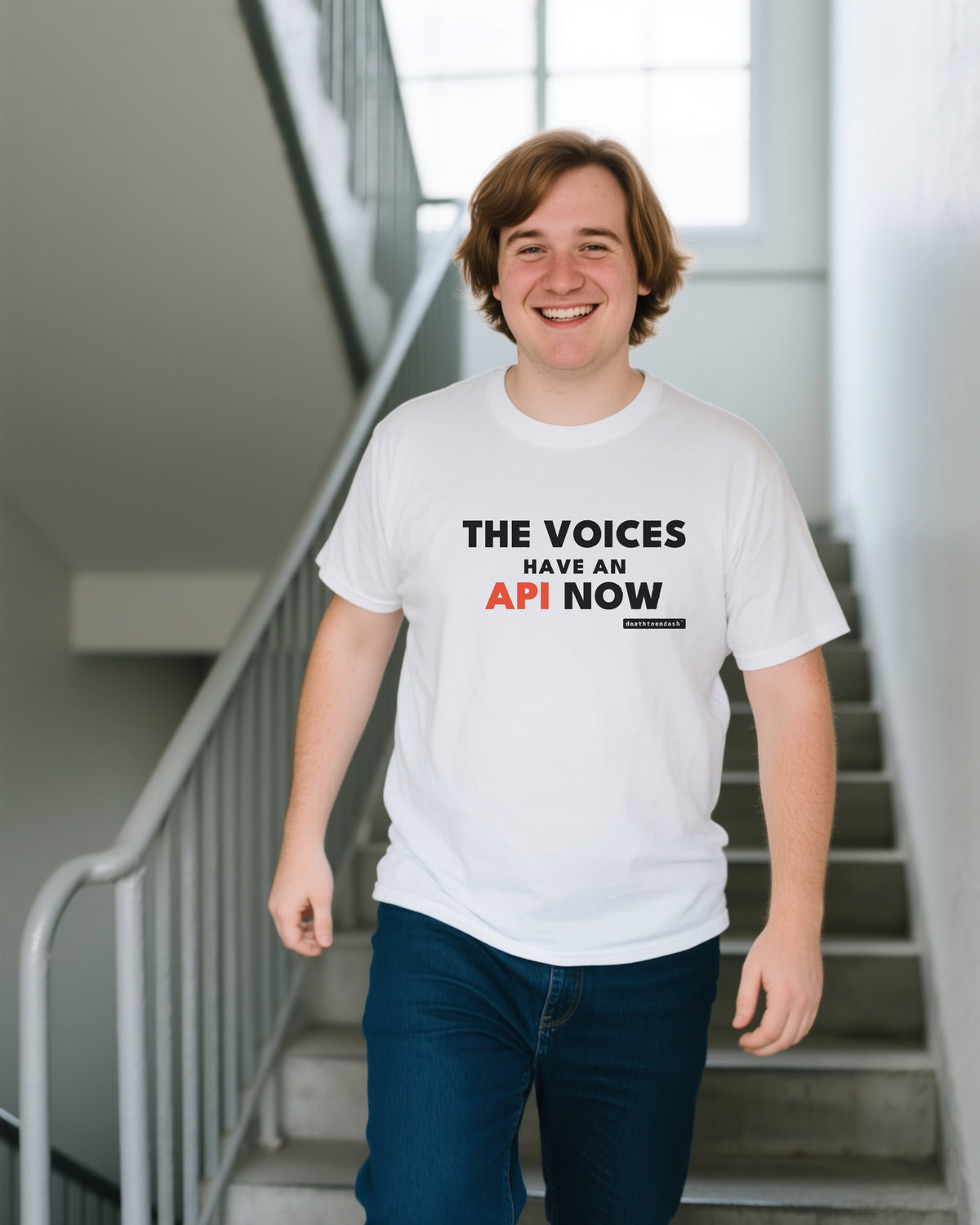 The Voices Have An Api Now unisex heavyweight t-shirt in white, worn