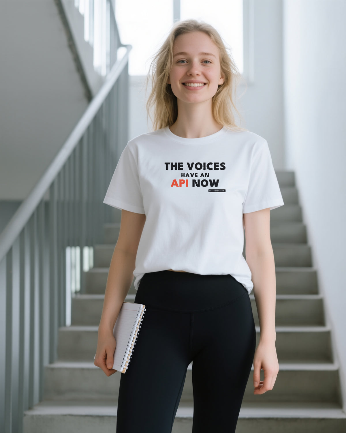 The Voices Have An Api Now unisex heavyweight t-shirt in white, worn