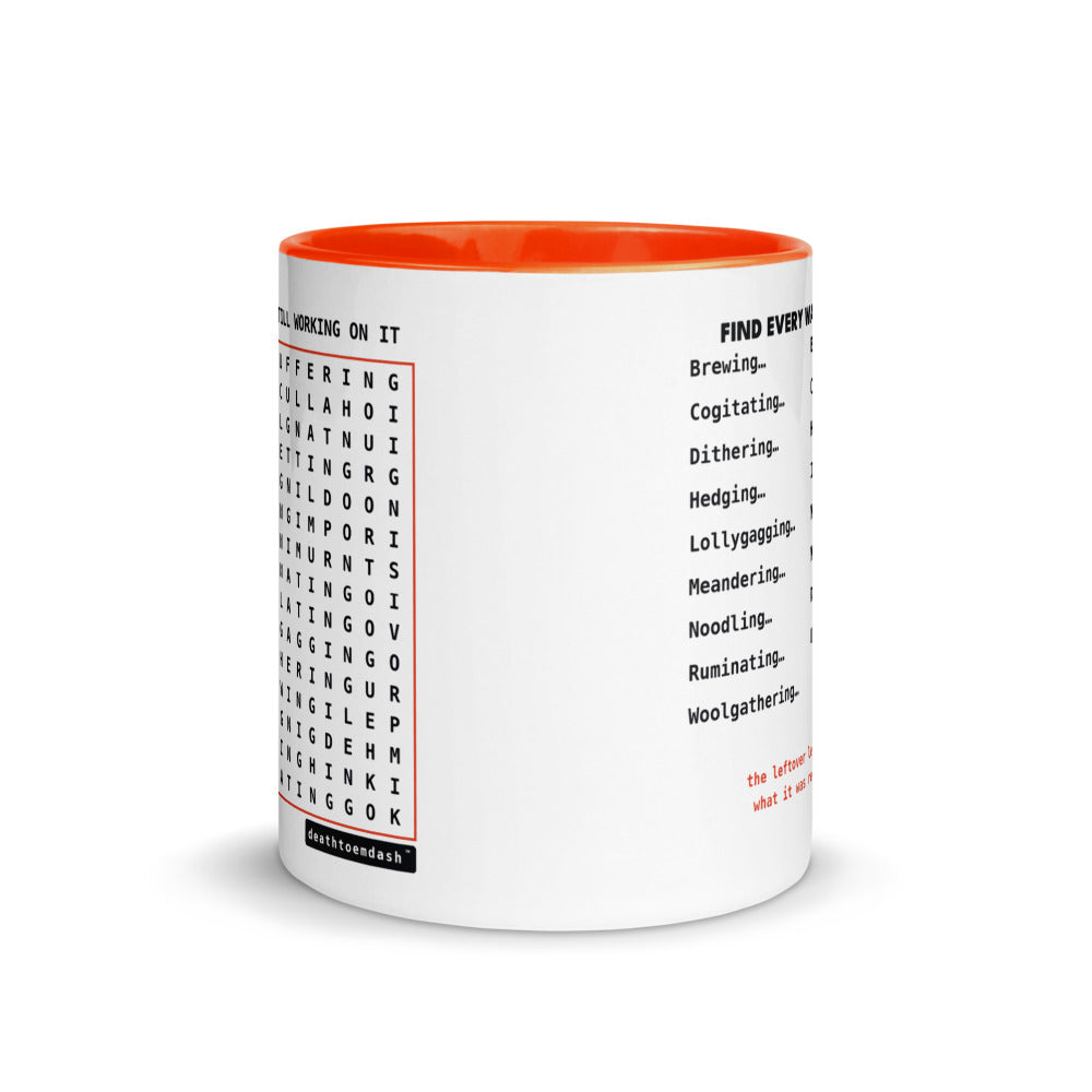 Another view of the mug, orange handle and interior