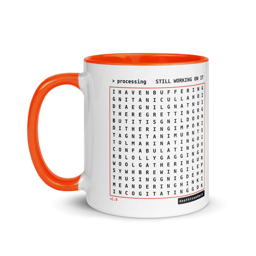 Another view of the mug, orange handle and interior