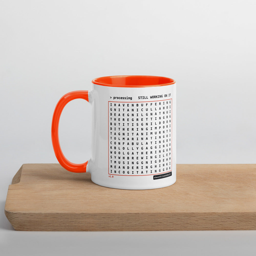Another view of the mug, orange handle and interior