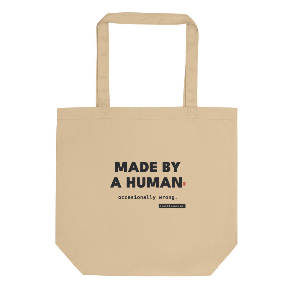 made by a human occasionally wrong tee, shown flat so the design reads